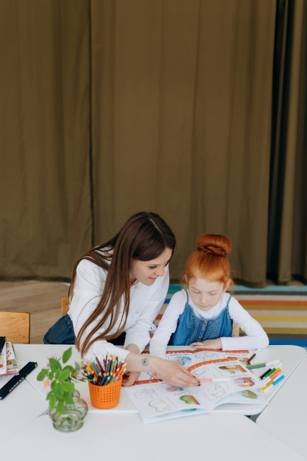 Therapist working with a child on activities