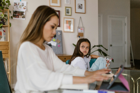 A child watching a distracted parent on their phone